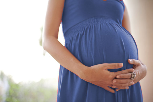Pregnant Woman with Blue Dress